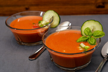 Transparent glass bowl with Gaspacho Andaluz. A vegetable and organic soup or cold drink that is drunk in summer or hot days.