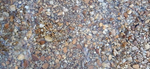 Gravel in the riverbed of the Ze Carlinhos waterfall, Delfinópolis, Minas Gerais