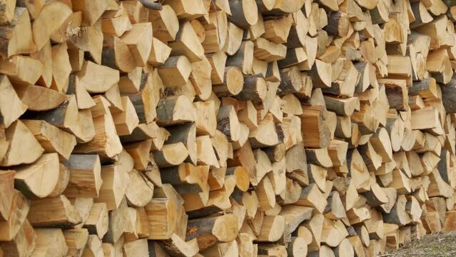 Texture from stacked firewood. Preparation of firewood for heating.