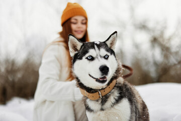 woman with a purebred dog on the snow walk play rest Lifestyle