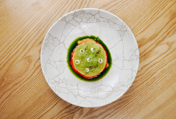 beautiful modern canned food with kiwi and herbs
