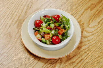 Light vegetable salad with cucumbers, lettuce, cucumbers