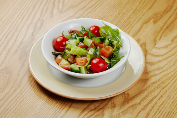 Light vegetable salad with cucumbers, lettuce, cucumbers