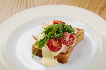 delicious breakfast sandwich with ham and salmon, cheese, egg, vegetables
