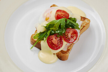 delicious breakfast sandwich with ham and salmon, cheese, egg, vegetables