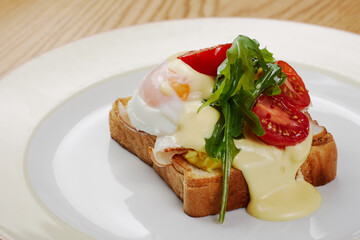 delicious breakfast sandwich with ham and salmon, cheese, egg, vegetables