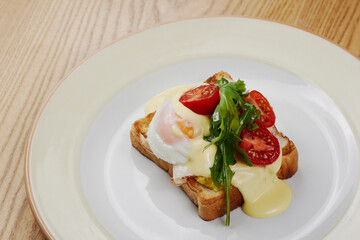 delicious breakfast sandwich with ham and salmon, cheese, egg, vegetables