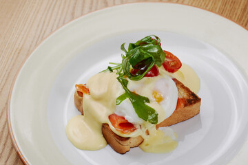 delicious breakfast sandwich with ham and salmon, cheese, egg, vegetables