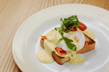 delicious breakfast sandwich with ham and salmon, cheese, egg, vegetables