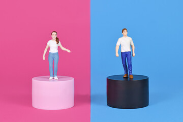 Concept for pink and blue gender stereotypes with man and woman figure on different colored...