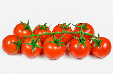 bunch of nine red ripe tomatoes over white background