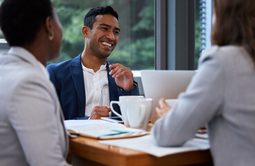 The speed of the boss is the speed of the team. Shot of a group of colleagues having a meeting and breakfast in a modern office. © Nina L/peopleimages.com