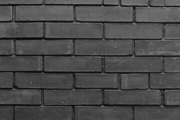 Black and white brick wall textured abstract background.