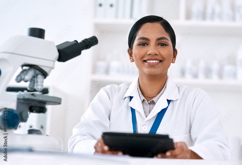 Poster technology plays a huge role in what i do. cropped portrait of an attractive young female scientist 