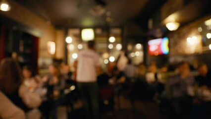 Blurry: Staff member collecting answers during bar quiz game at night party