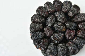 Arabic dates, ajwa dates on the white
