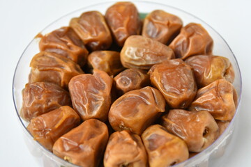 Arabic dates, sugary dates on the white
