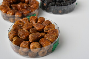 Arabic dates, sugary dates on the white
