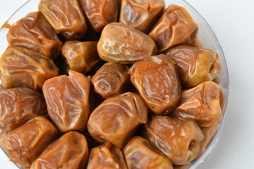 Arabic dates, sugary dates on the white
