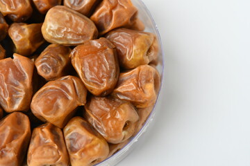 Arabic dates, sugary dates on the white
