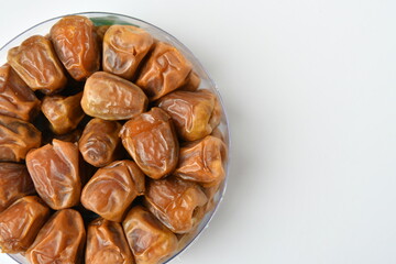 Arabic dates, sugary dates on the white
