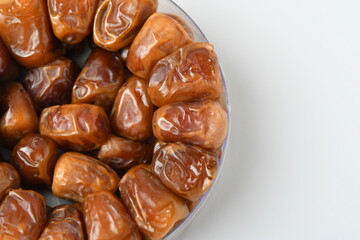 Arabic dates, sugary dates on the white
