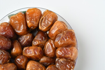 Arabic dates, sugary dates on the white
