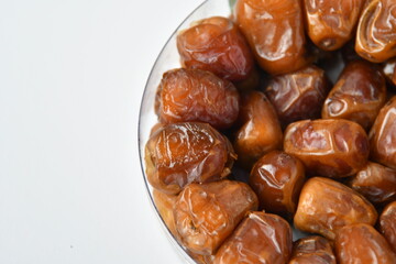 Arabic dates, sugary dates on the white
