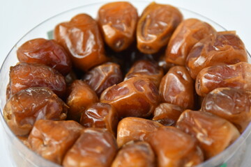 Arabic dates, sugary dates on the white
