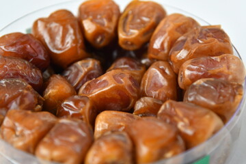Arabic dates, sugary dates on the white
