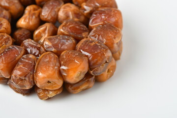 Arabic dates, sugary dates on the white
