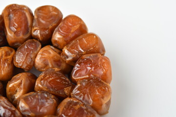 Arabic dates, sugary dates on the white
