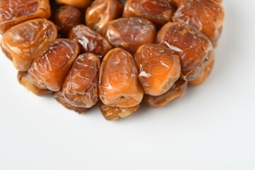 Arabic dates, sugary dates on the white
