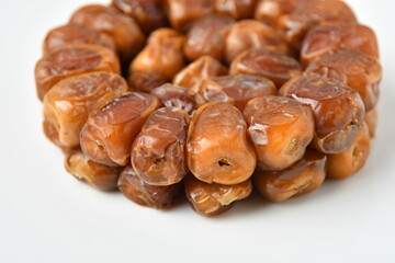 Arabic dates, sugary dates on the white
