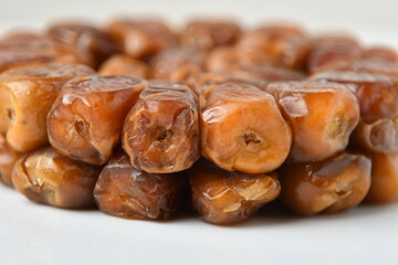Arabic dates, sugary dates on the white
