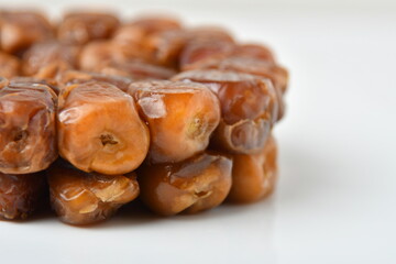Arabic dates, sugary dates on the white
