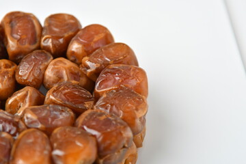 Arabic dates, sugary dates on the white
