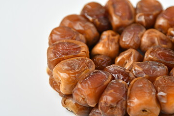 Arabic dates, sugary dates on the white

