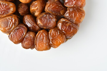 Arabic dates, sugary dates on the white
