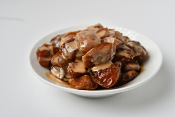 Fresh Arabian dates (Khalas dates ) isolated on white background