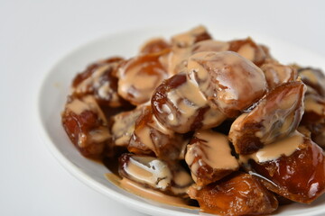 Fresh Arabian dates (Khalas dates ) isolated on white background