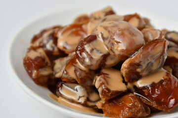 Fresh Arabian dates (Khalas dates ) isolated on white background