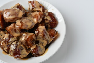 Fresh Arabian dates (Khalas dates ) isolated on white background