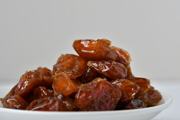 Fresh Arabian dates (Khalas dates ) isolated on white background