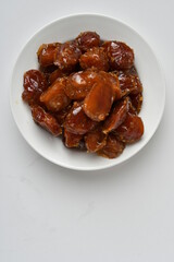 Fresh Arabian dates (Khalas dates ) isolated on white background