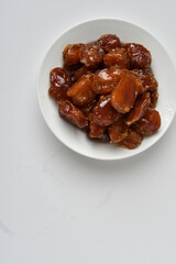 Fresh Arabian dates (Khalas dates ) isolated on white background