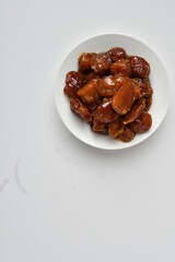 Fresh Arabian dates (Khalas dates ) isolated on white background