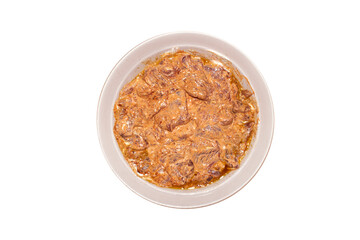 Pork meat in barbecue sauce.Pork kebab in marinade on a plate.Pork meat in marinade on a white background.