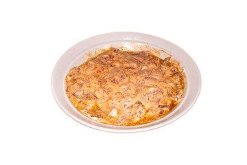 Pork meat in barbecue sauce.Pork kebab in marinade on a plate.Pork meat in marinade on a white background.