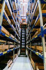 Forklift loader in Modern warehouse interior with shelves and boxes